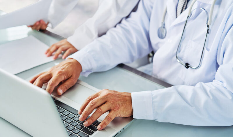 Physician working on computer